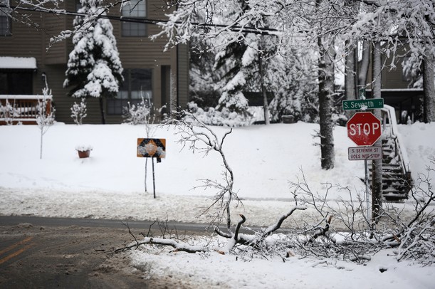 Broken tree branches block the right turn lane on W Madison St. at S 7th St. on Wednesday, Feb. 27, 2013. Melanie Maxwell I AnnArbor.com